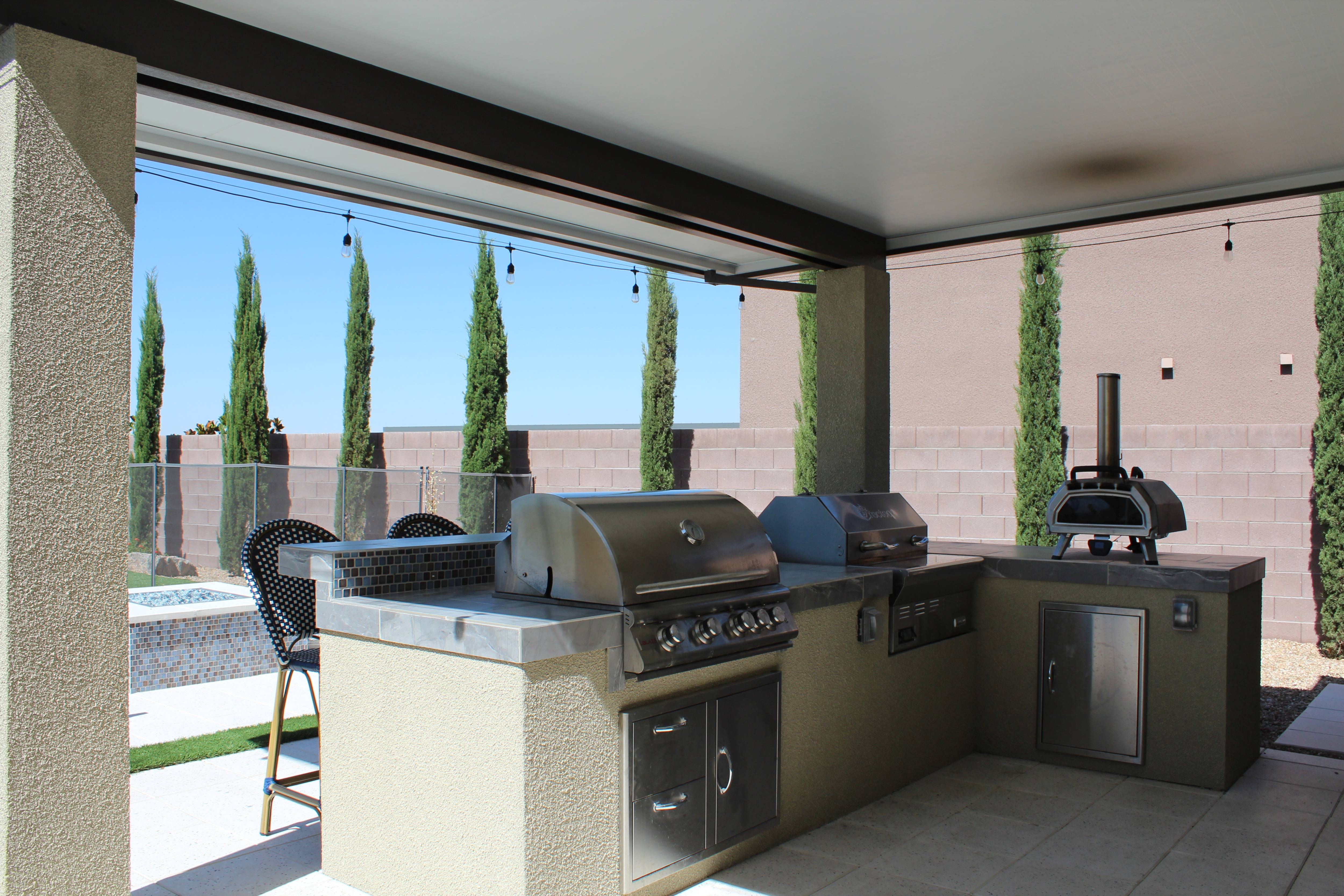 Elegant outdoor dining space with large pergola, rustic wooden table, and surrounding greenery