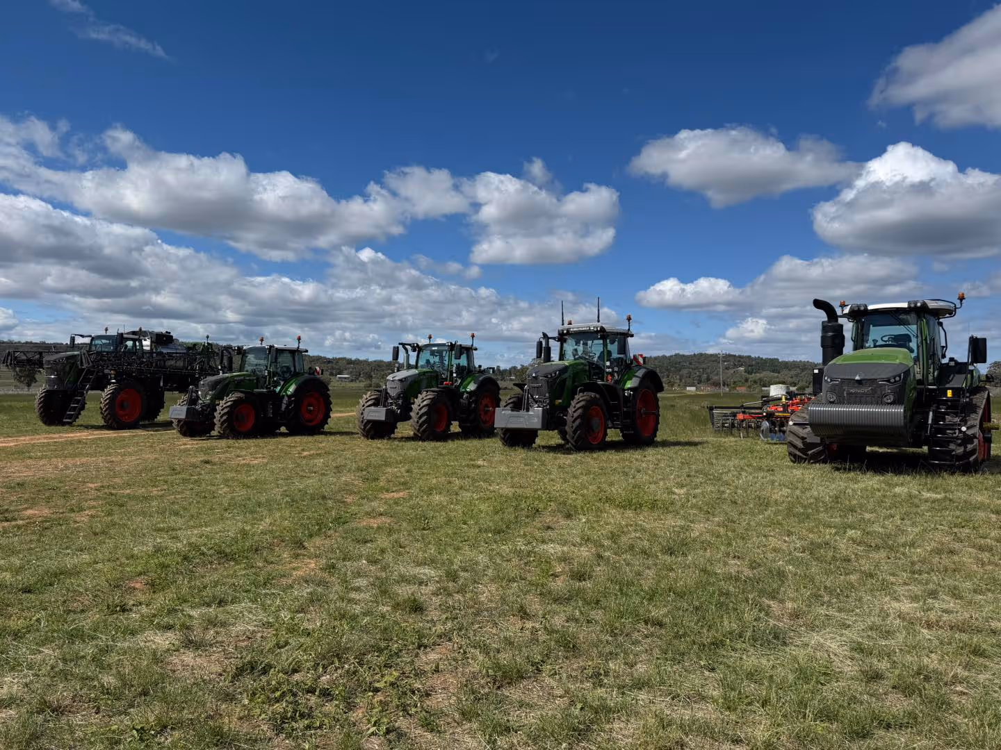 Fendt machinery lined up in a field