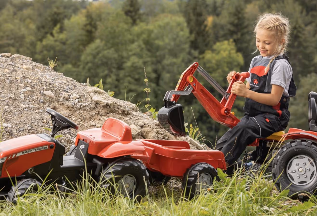 Young child playing with Massey Ferguson toys