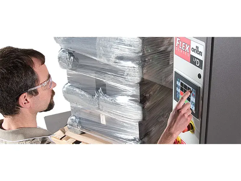 Side angle view demonstrating low profile design for easy forklift access