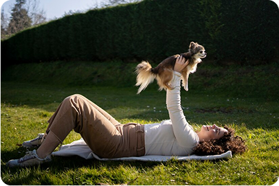 Trainer working with dog on leash outdoors