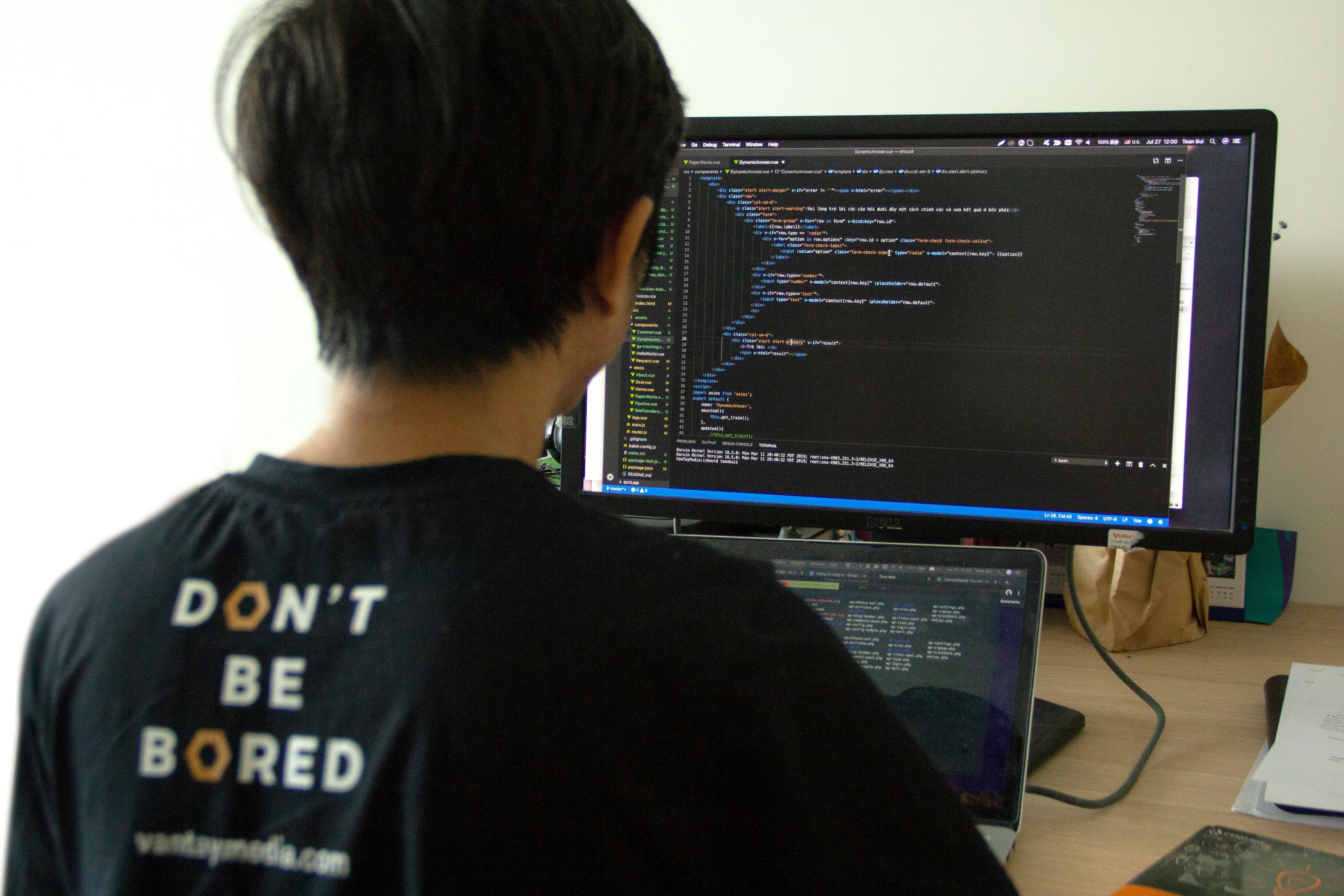 Software developer using AI-assisted coding tools for secure application development and cybersecurity automation.