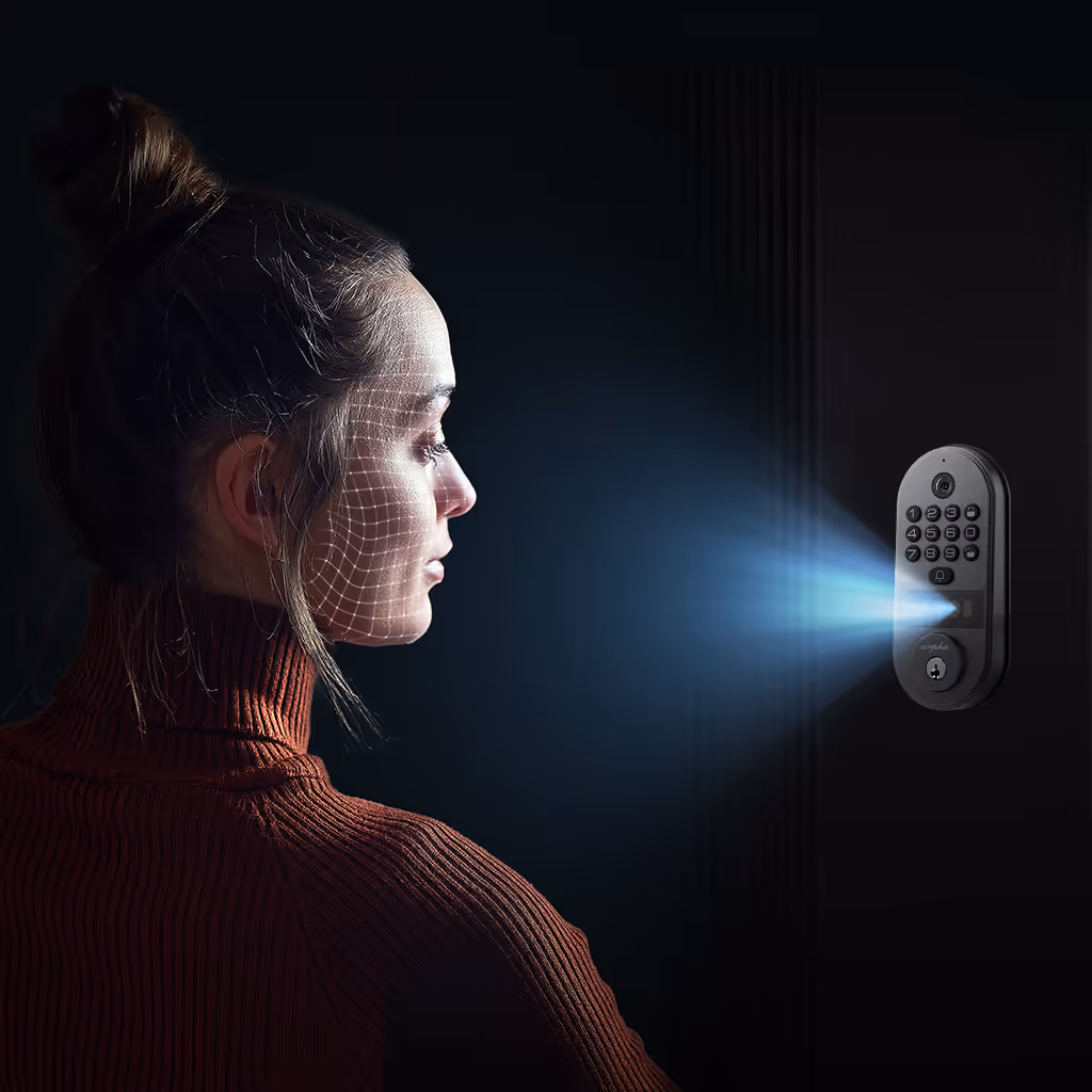 Woman with a face scan grid pattern looking at a wall-mounted smart lock with illuminated blue light.