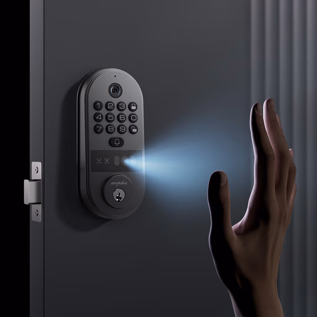 Hand held up to a smart door lock with keypad and camera emitting a blue light.