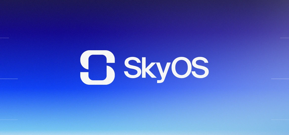 Person using the SkyOS mobile app at a desk with a notebook, coffee, and laptop nearby