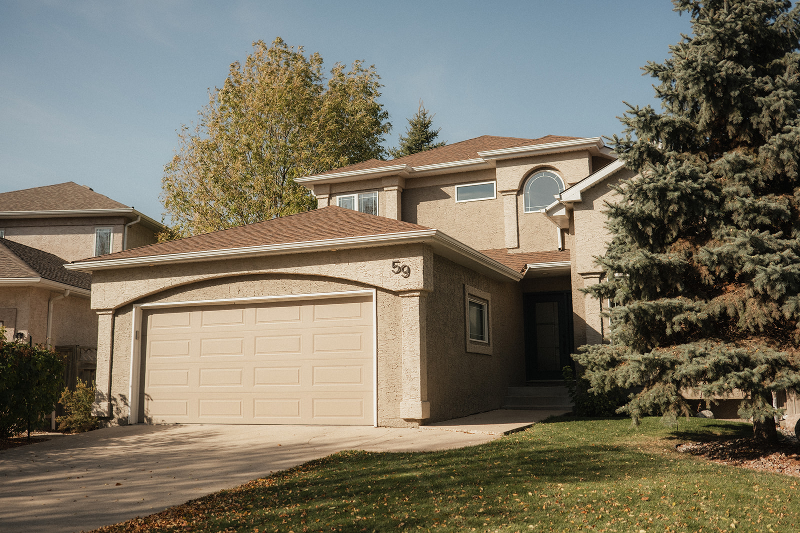 Close-up of a painter from Integrity Painting prepping a roller with fresh paint, highlighting the clean and organized workspace maintained on every job site.