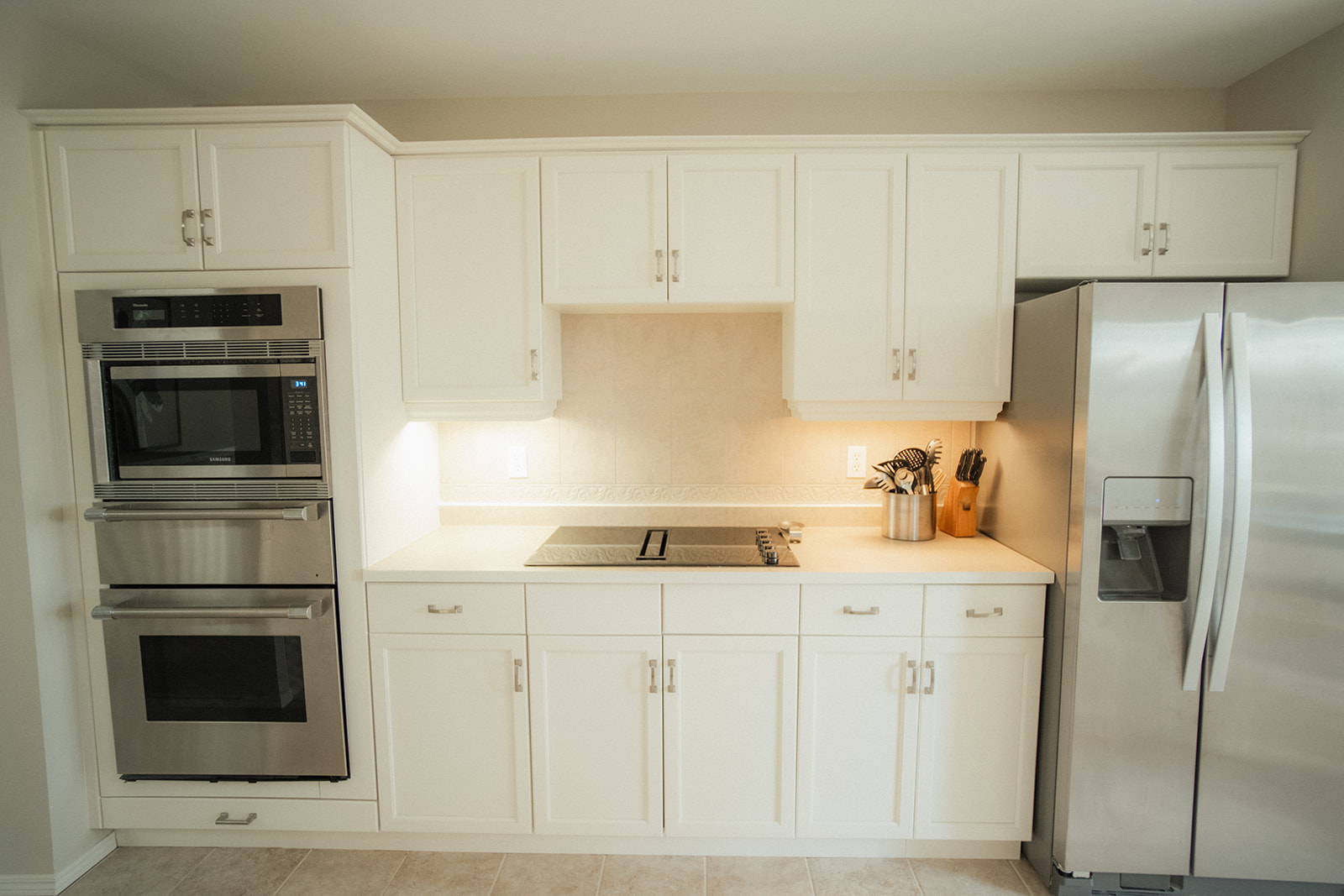 Kitchen cabinet makeover, sanding and refinishing for smooth finish