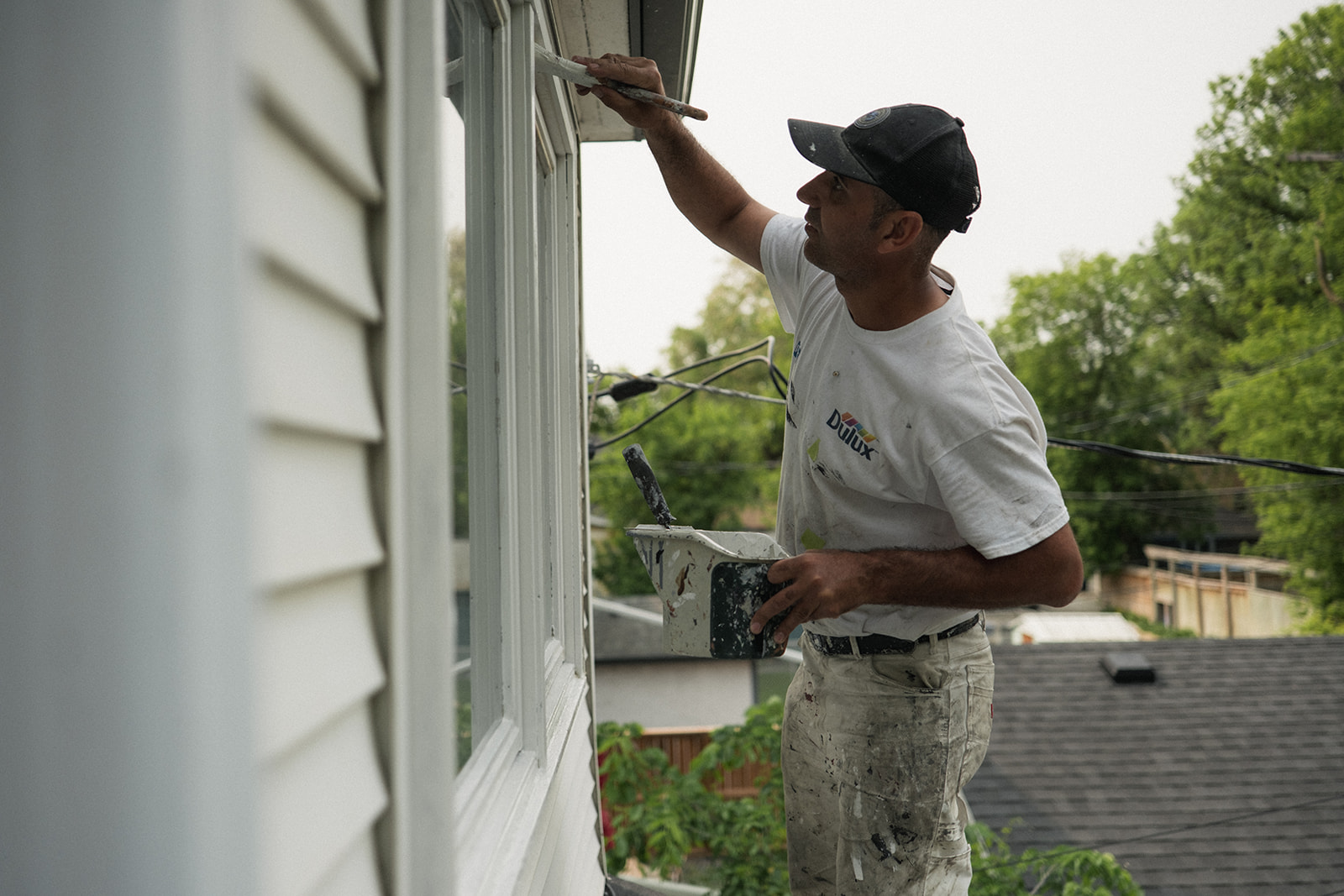 Professional HOA painting, painting white trim around windows