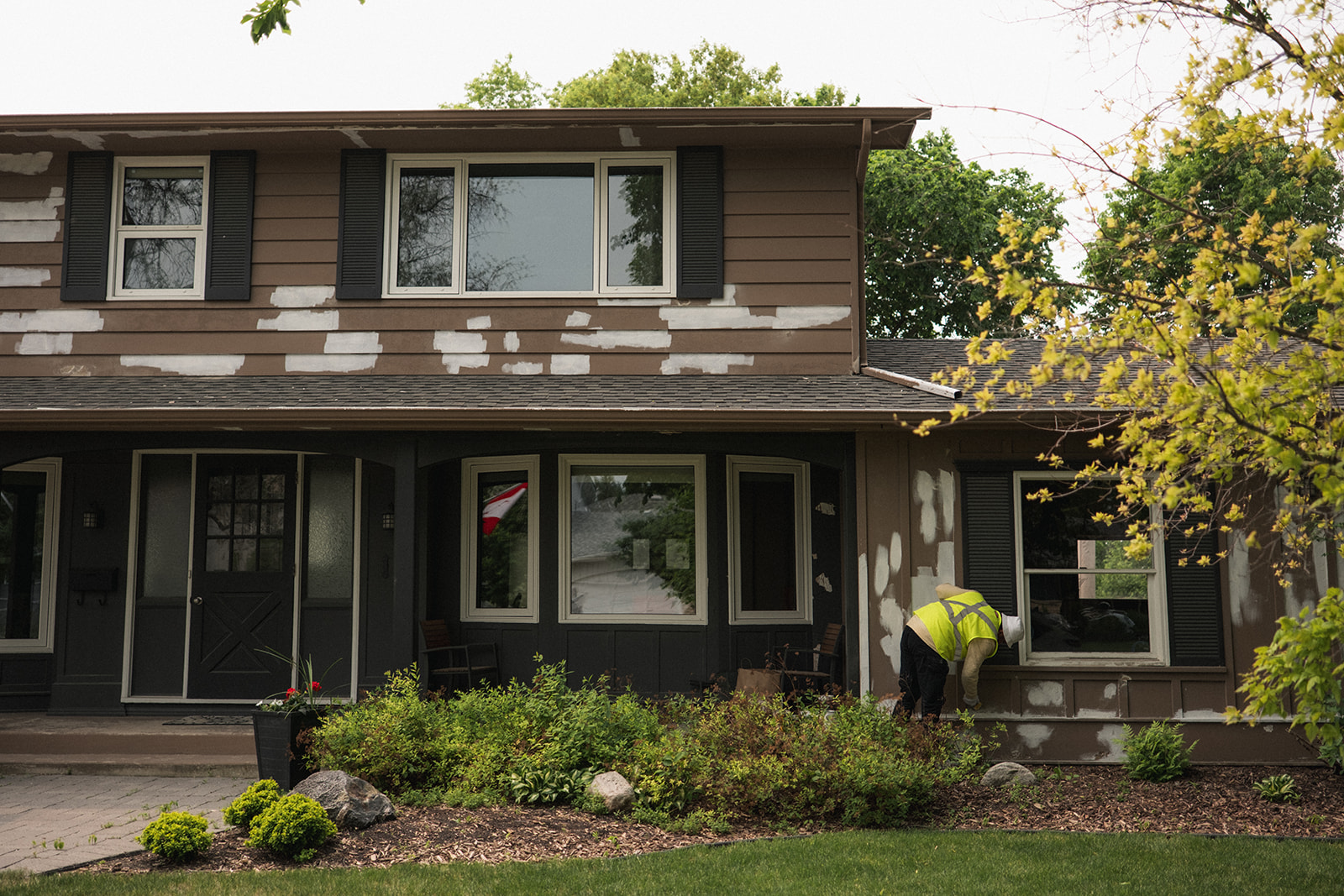 Completed exterior painting project for a residential house