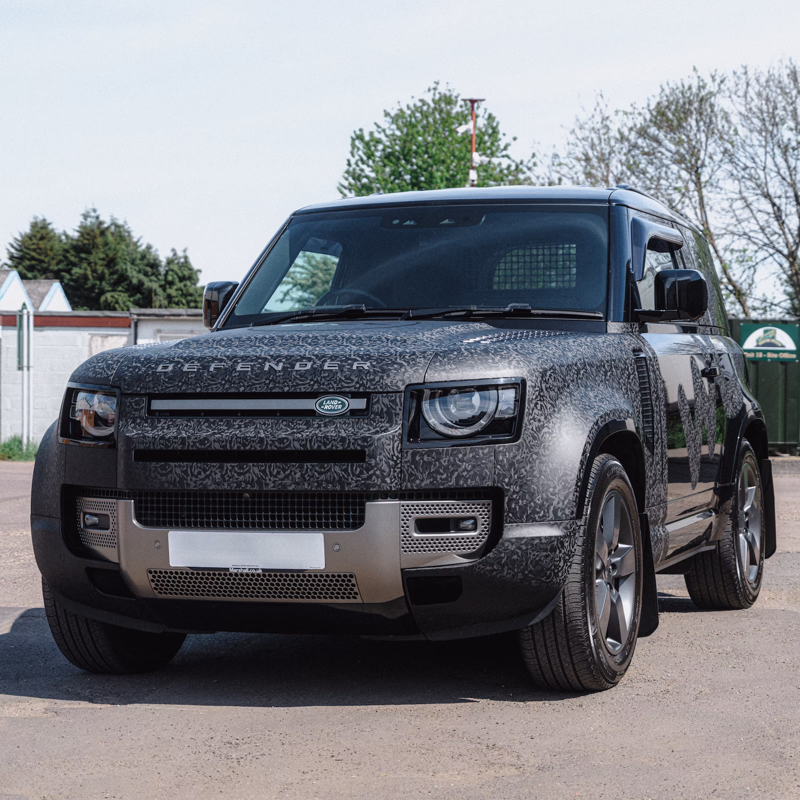 A camo wrapped Defender by WCC.