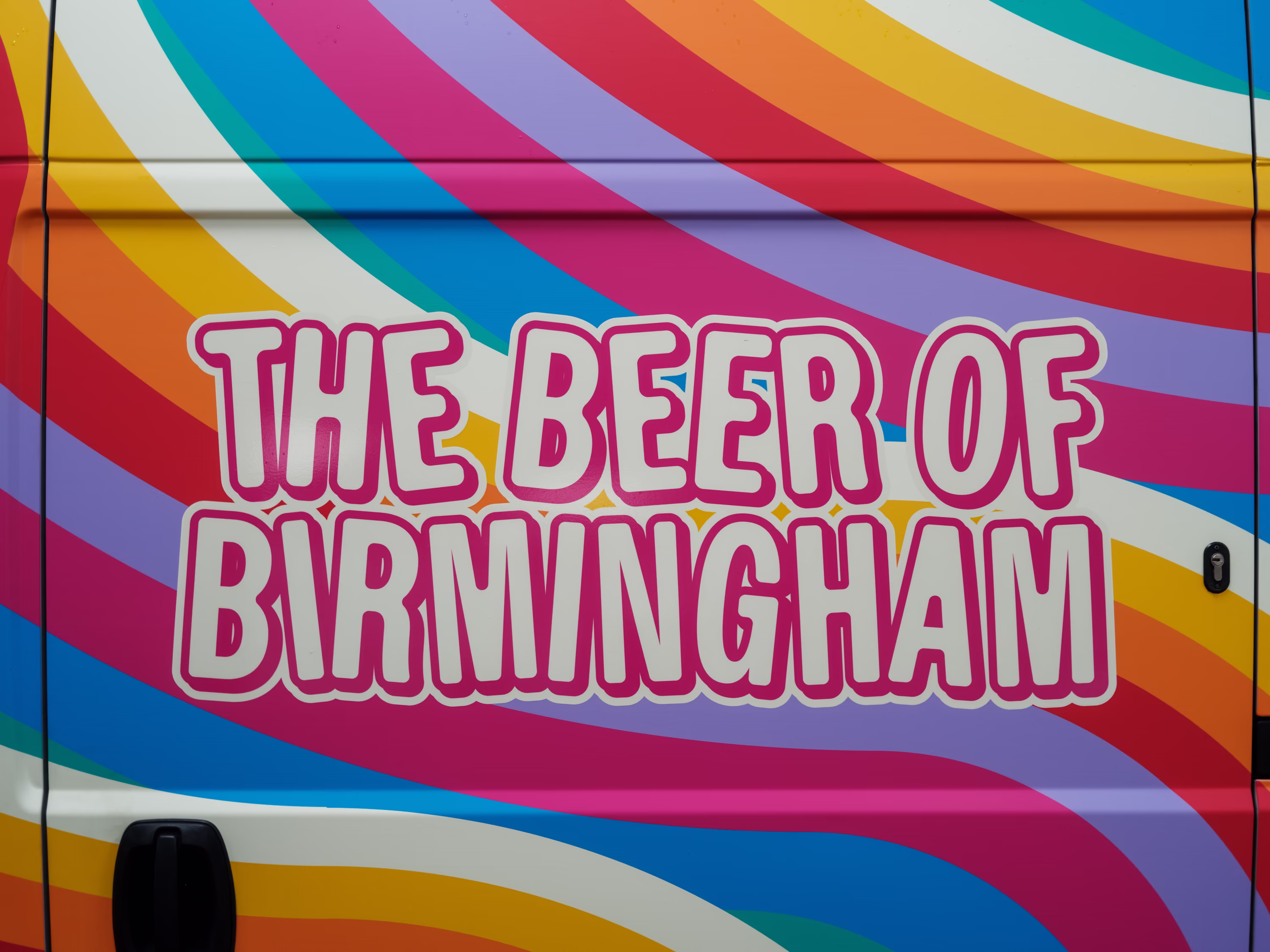 The 'Beer of Birmingham' slogan of Attic Brew, applied to the door of their van, wrapped by WCC.