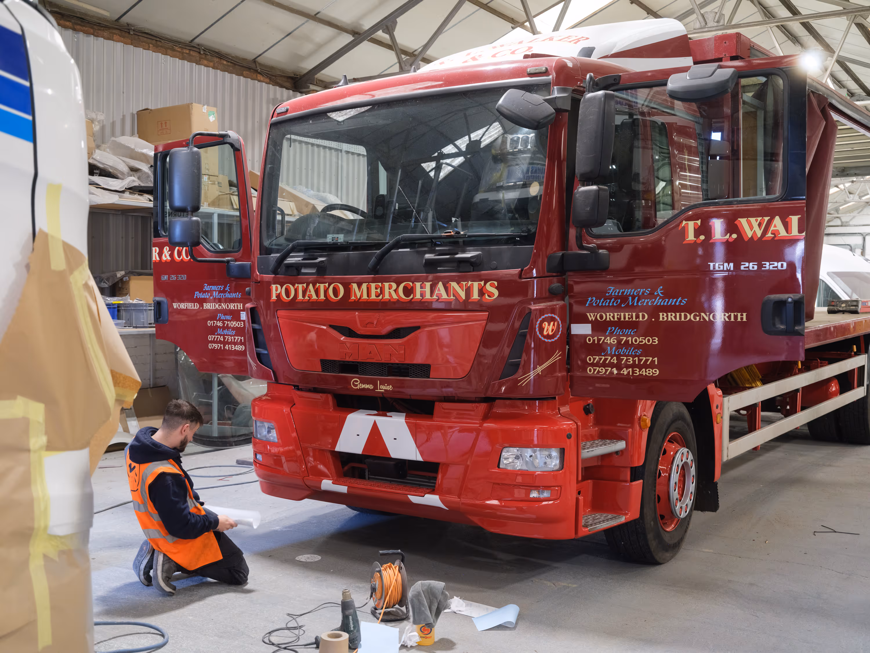 White front bumper chevrons installed on T L Walker & Co vehicle by graphics team