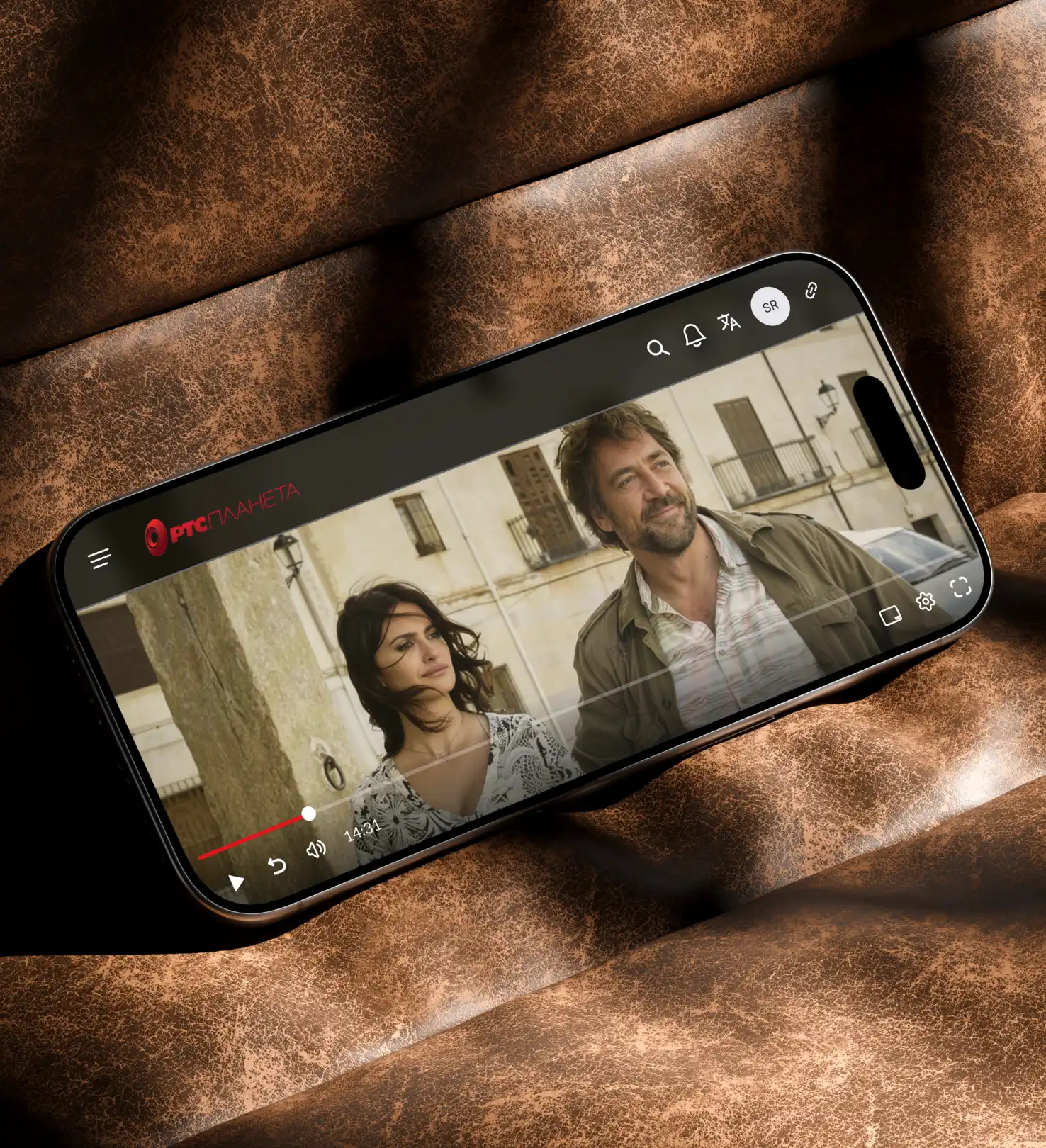 Forleap Marketing. RTS Planeta cover image case study. Smartphone displaying a paused video of a man and woman standing outdoors near a stone wall.