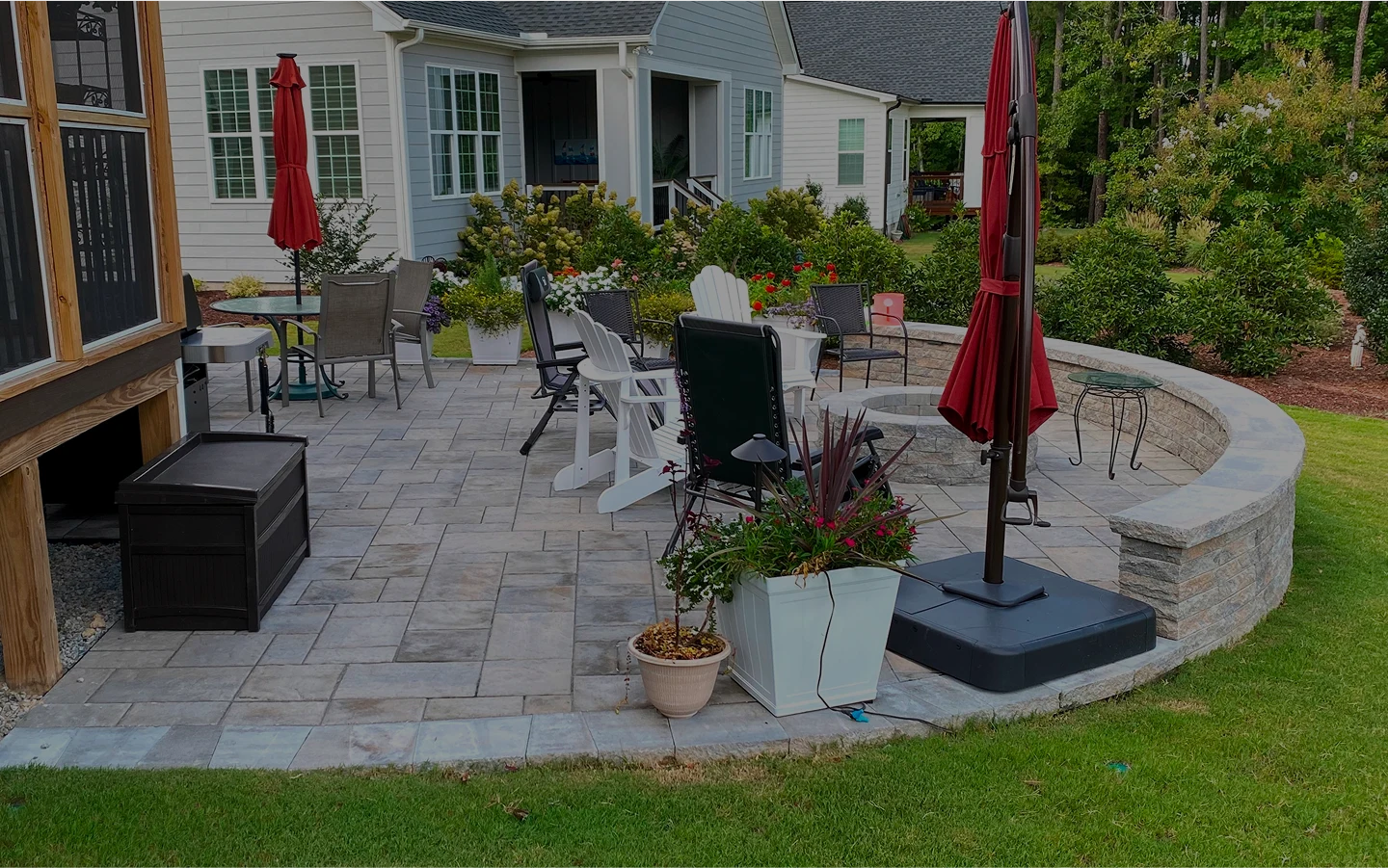 A patio featuring a table surrounded by chairs, ideal for outdoor dining and relaxation.