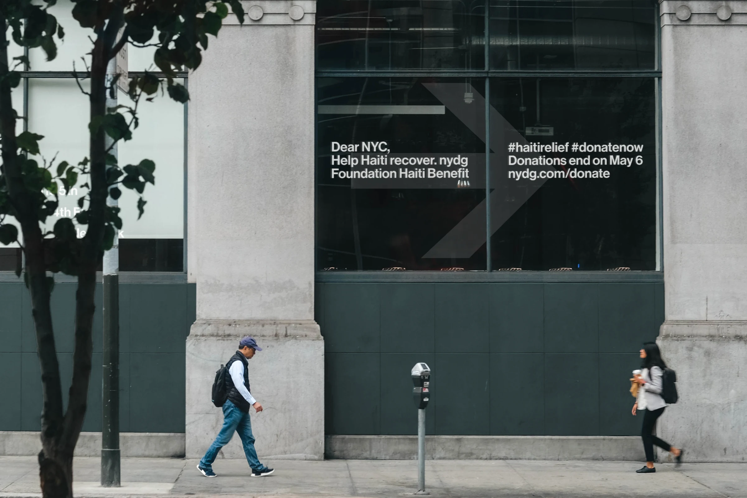 A storefront ad for the Haiti Benefit awareness campaign