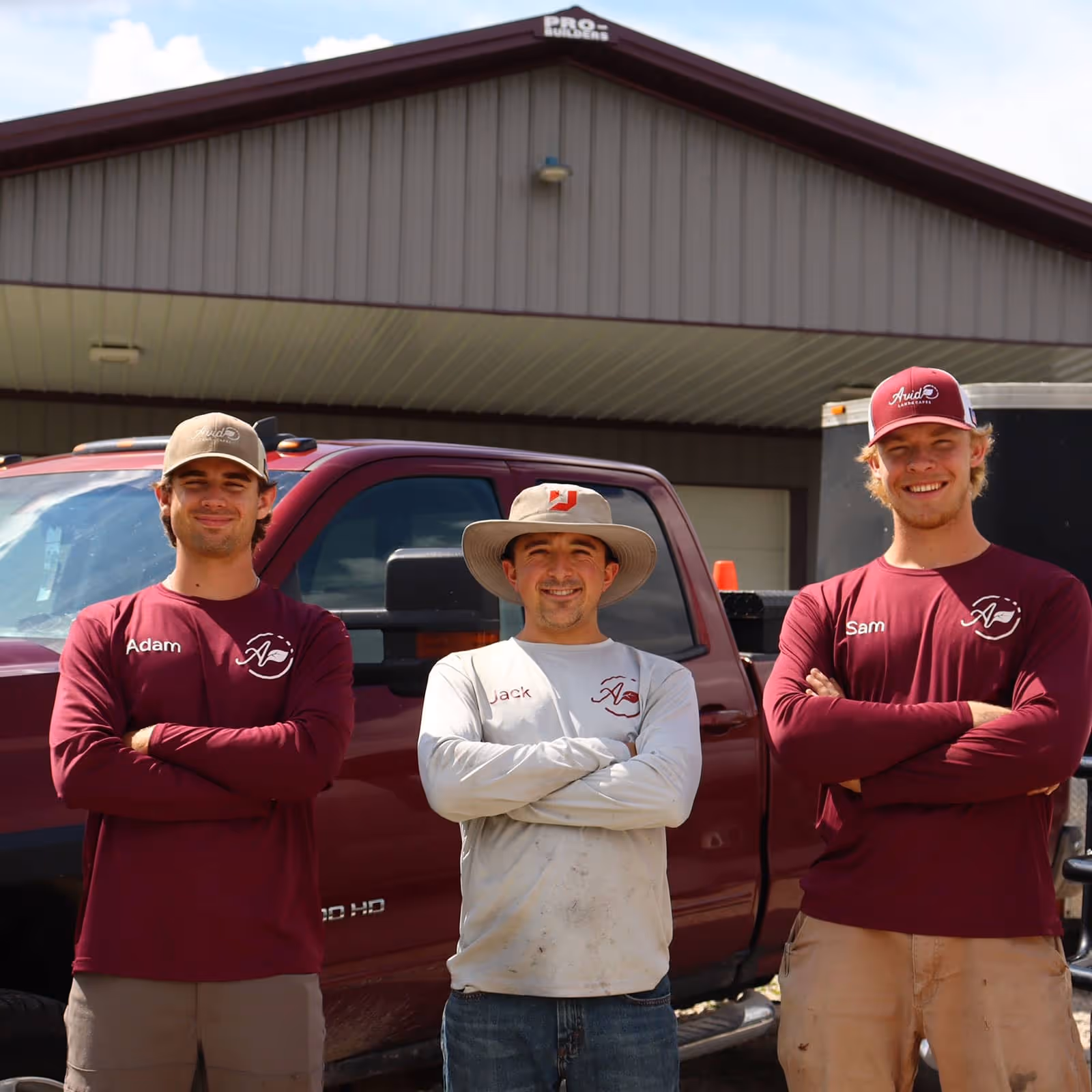 Avid Landscapes crew working — shrub trimming & bed edging in Mayville WI