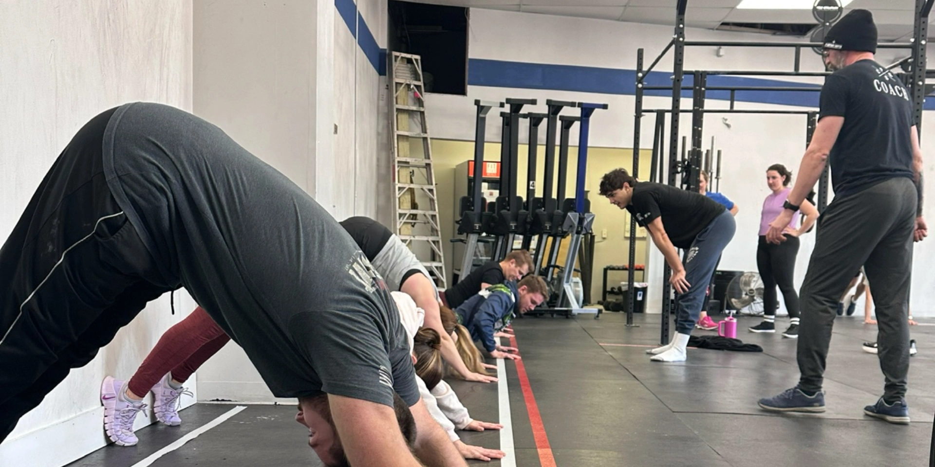 CrossFit training session at CrossFit Empire South in Huntsville, AL, showcasing diverse fitness activities and participants.