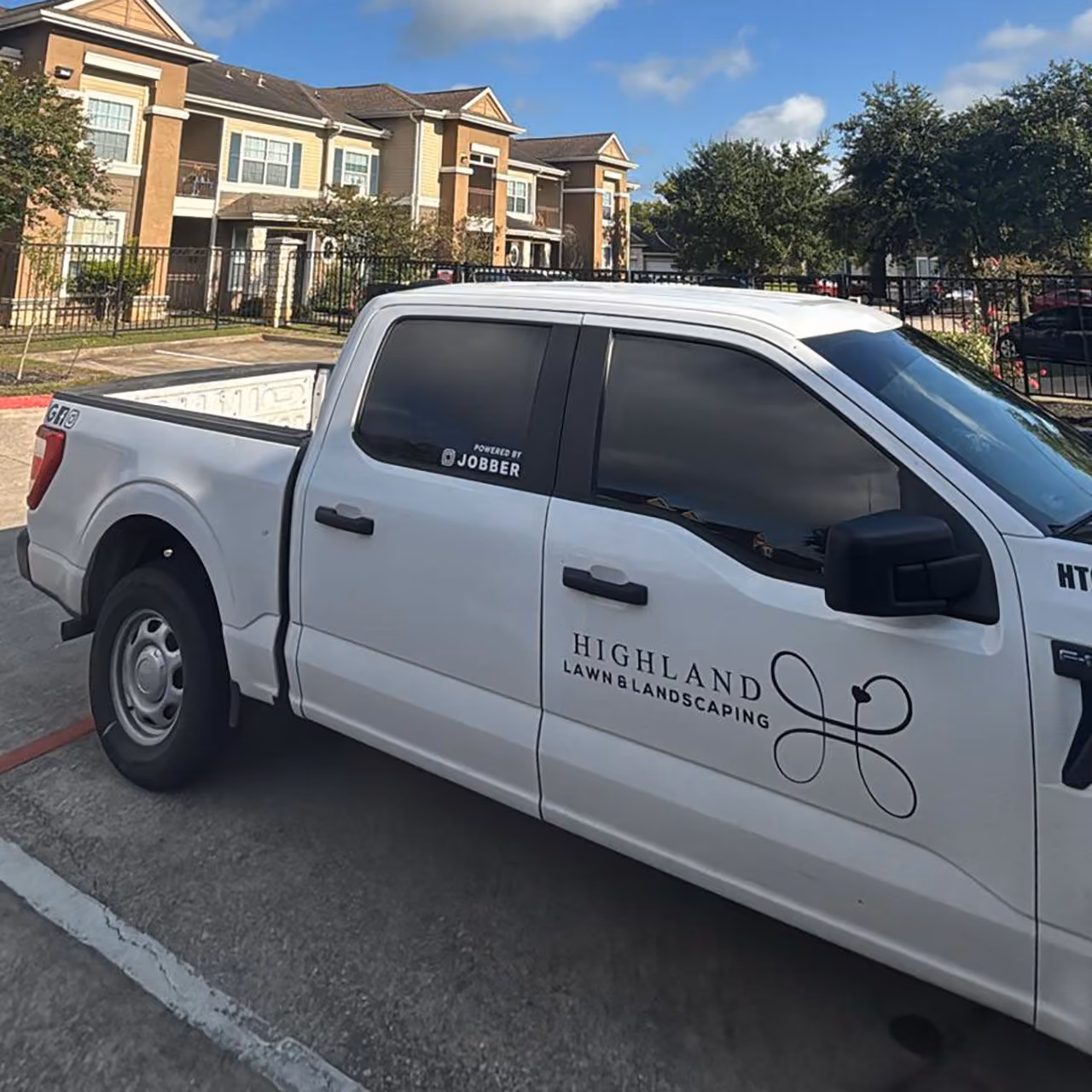 Highland Lawn & Landscaping branded work truck near me