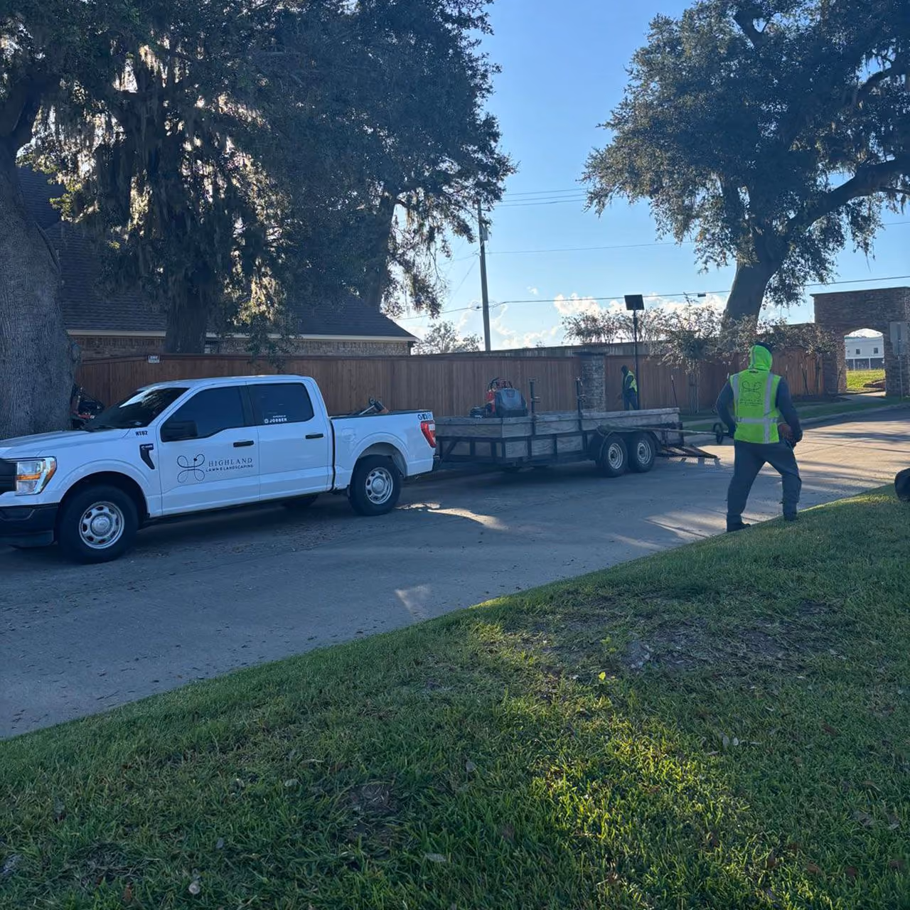 Highland Lawn & Landscaping branded work truck serving commercial properties in Fort Bend County