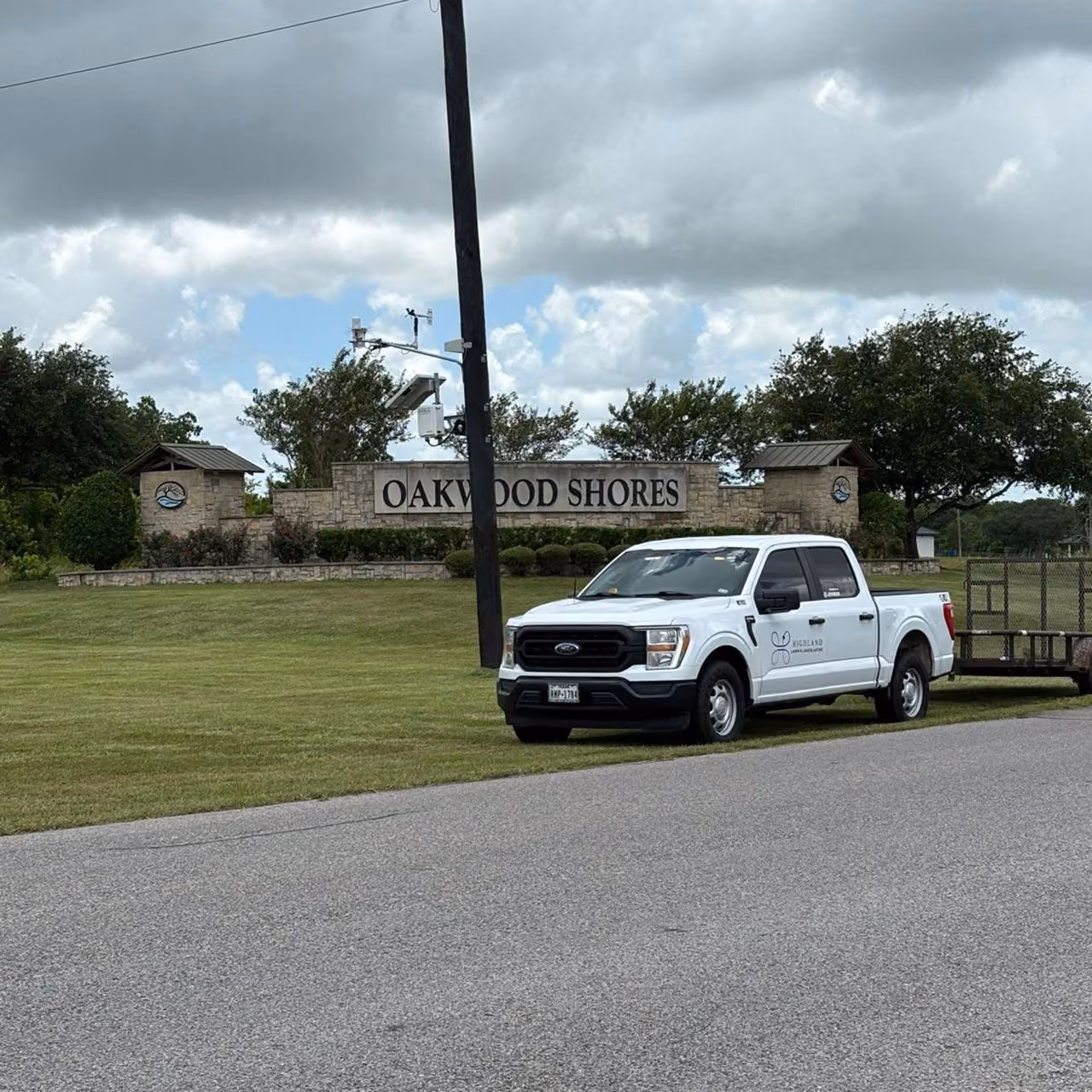 Highland Lawn & Landscaping company truck at a commercial landscaping project in Brazoria County
