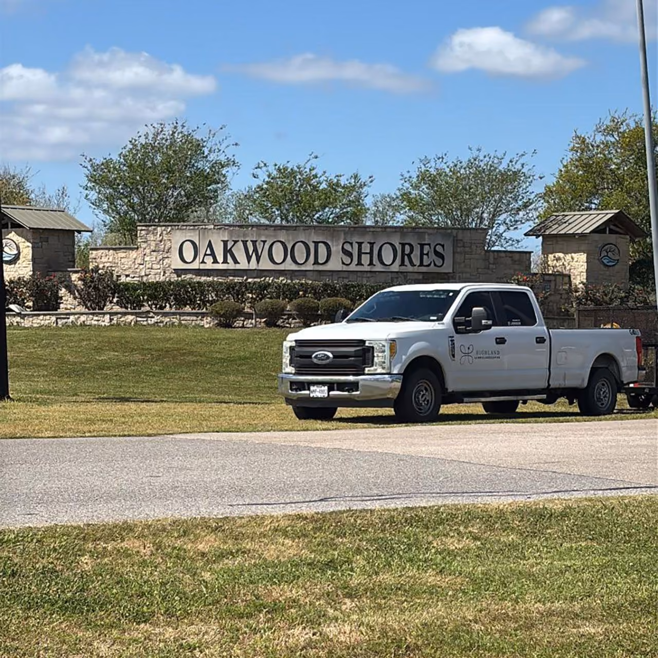Highland Lawn & Landscaping company truck providing commercial landscaping services in Brazoria County