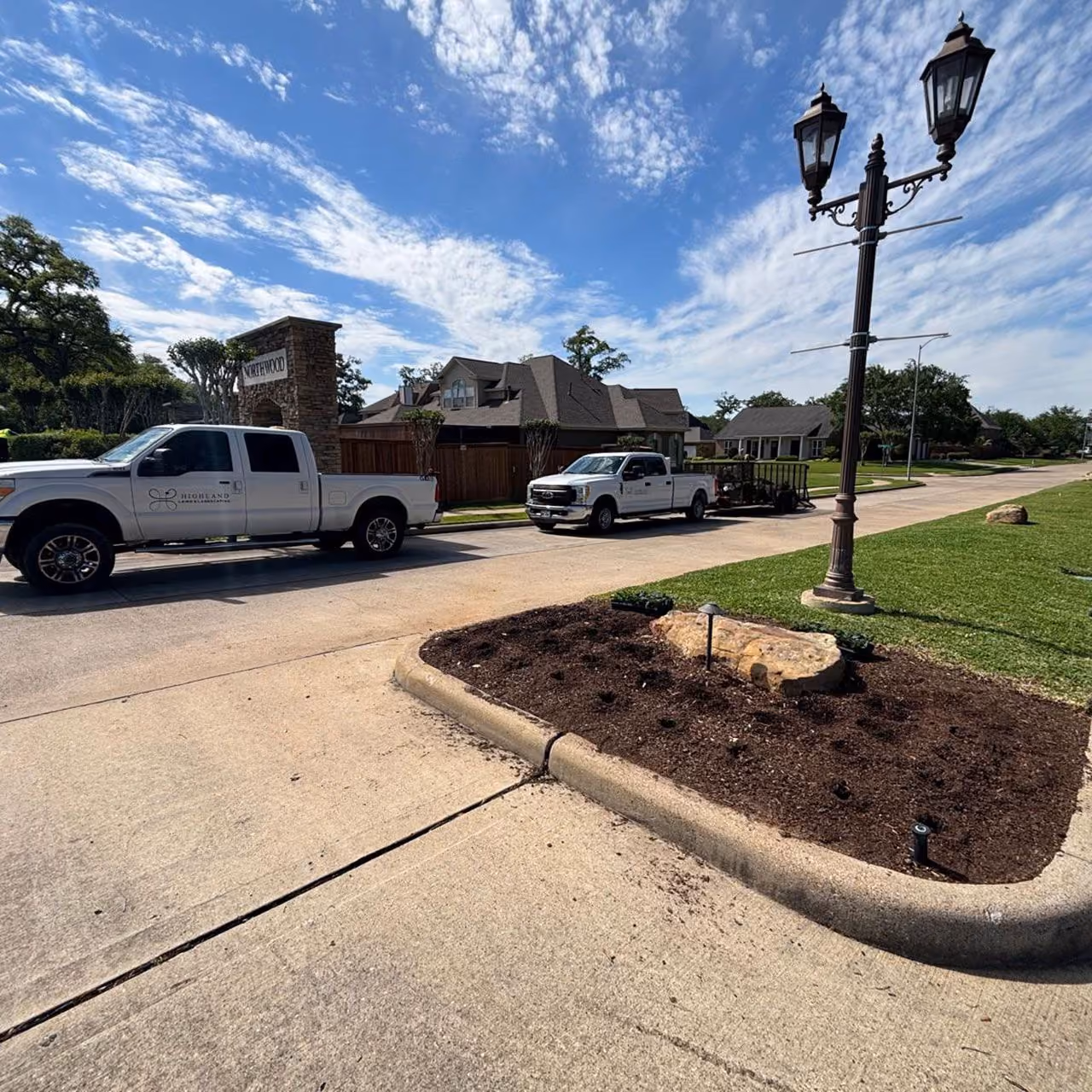 Highland Lawn & Landscaping branded truck providing landscape services near me