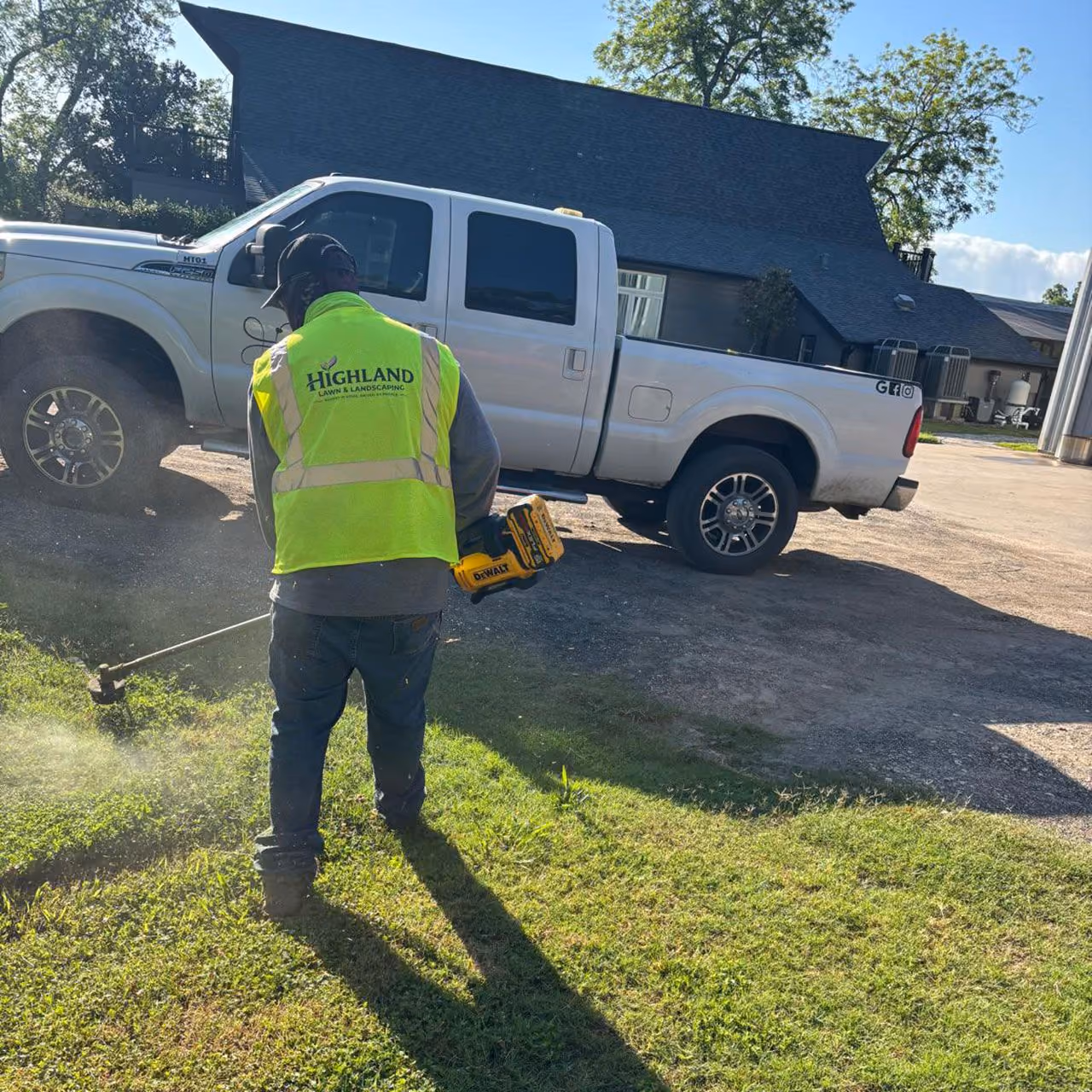 Landscape maintenance worker providing professional grounds care in Fort Bend County