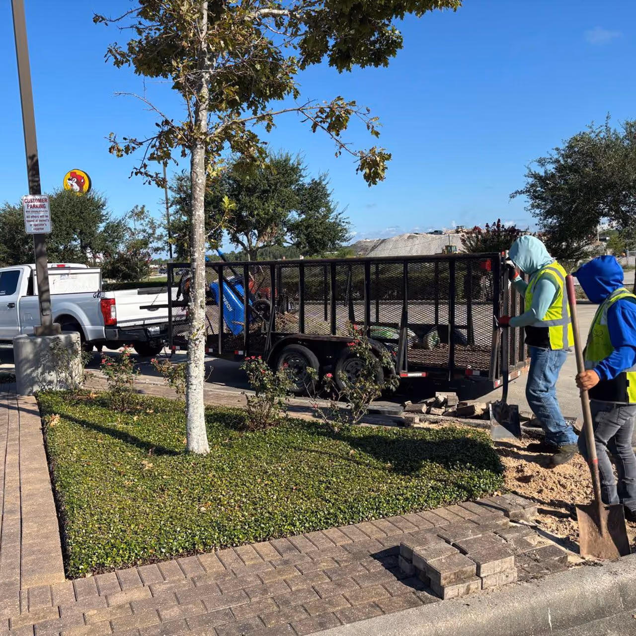Highland Lawn & Landscaping team working on landscape installation