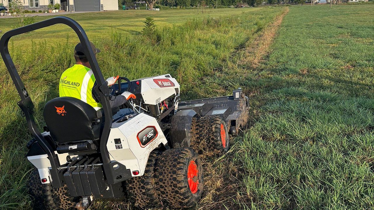 Slope, Brush, and unkempt property maintenance by Highland Lawn and Landscaping.
