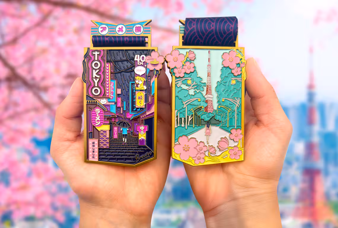 Tokyo Medal front and back in the hands