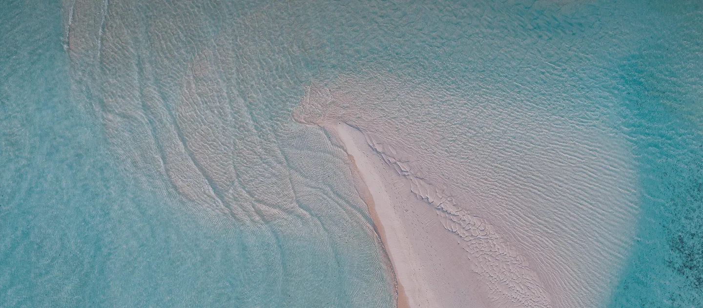 The refined white texture of the interior design at MJ Holidays evokes purity and elegance.