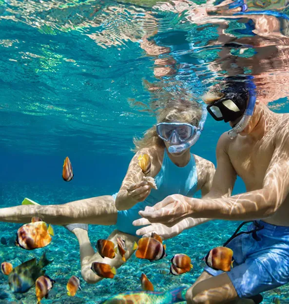 A couple enjoying scuba diving in Mauritius, a romantic and unforgettable experience offered by MJ Holidays.