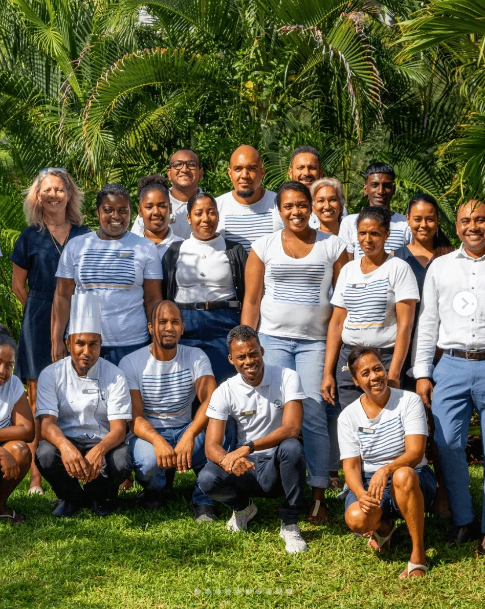 Smiling employees welcoming travelers to the Serenity Pool Villa with MJ Holidays in Mauritius.