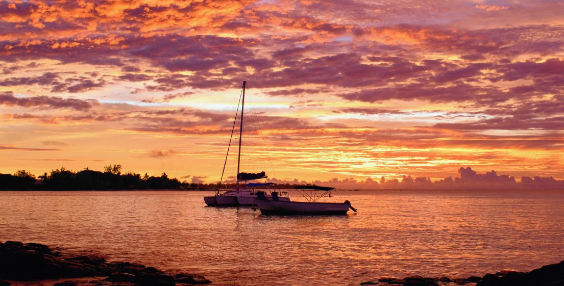 A sunset over the sea in Mauritius, offering a moment of serenity and natural beauty during an MJ Holidays holiday.