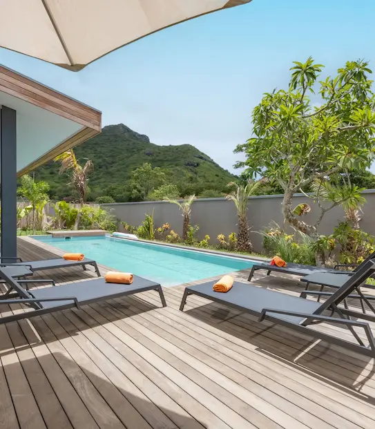 Private pool surrounded by sun loungers at the Signature Pool Villa with MJ Holidays in Mauritius.