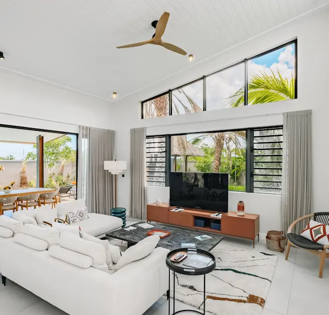 Bright and refined living room of the Signature Pool Villa with MJ Holidays in Mauritius.