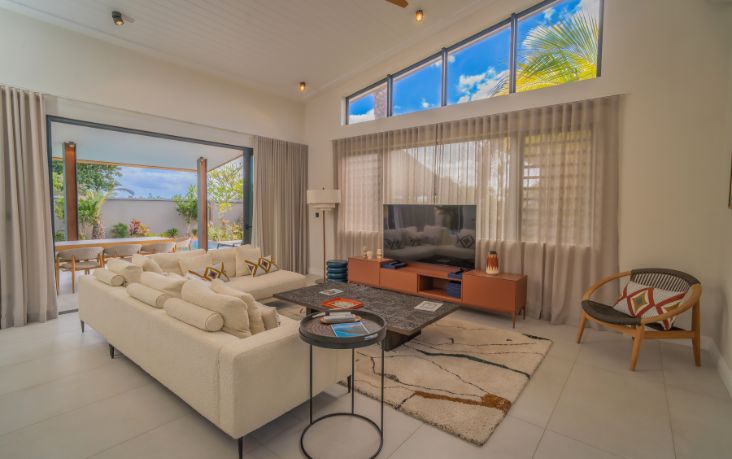 The spacious living room of a villa in Mauritius combines elegance and comfort for a high-end stay with MJ Holidays.