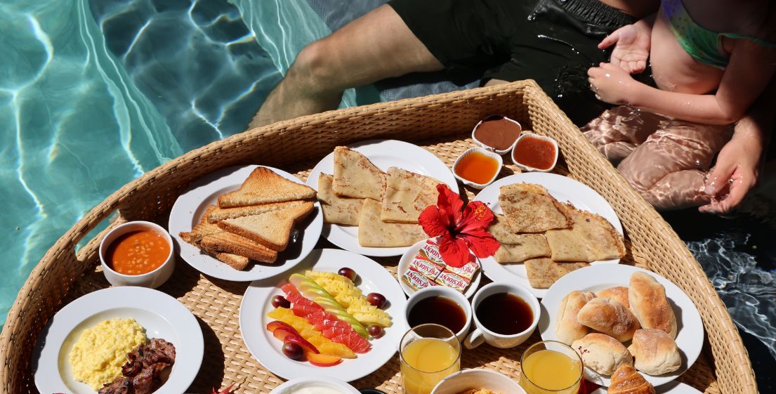 Family breakfast by the pool with MJ Holidays in Mauritius.