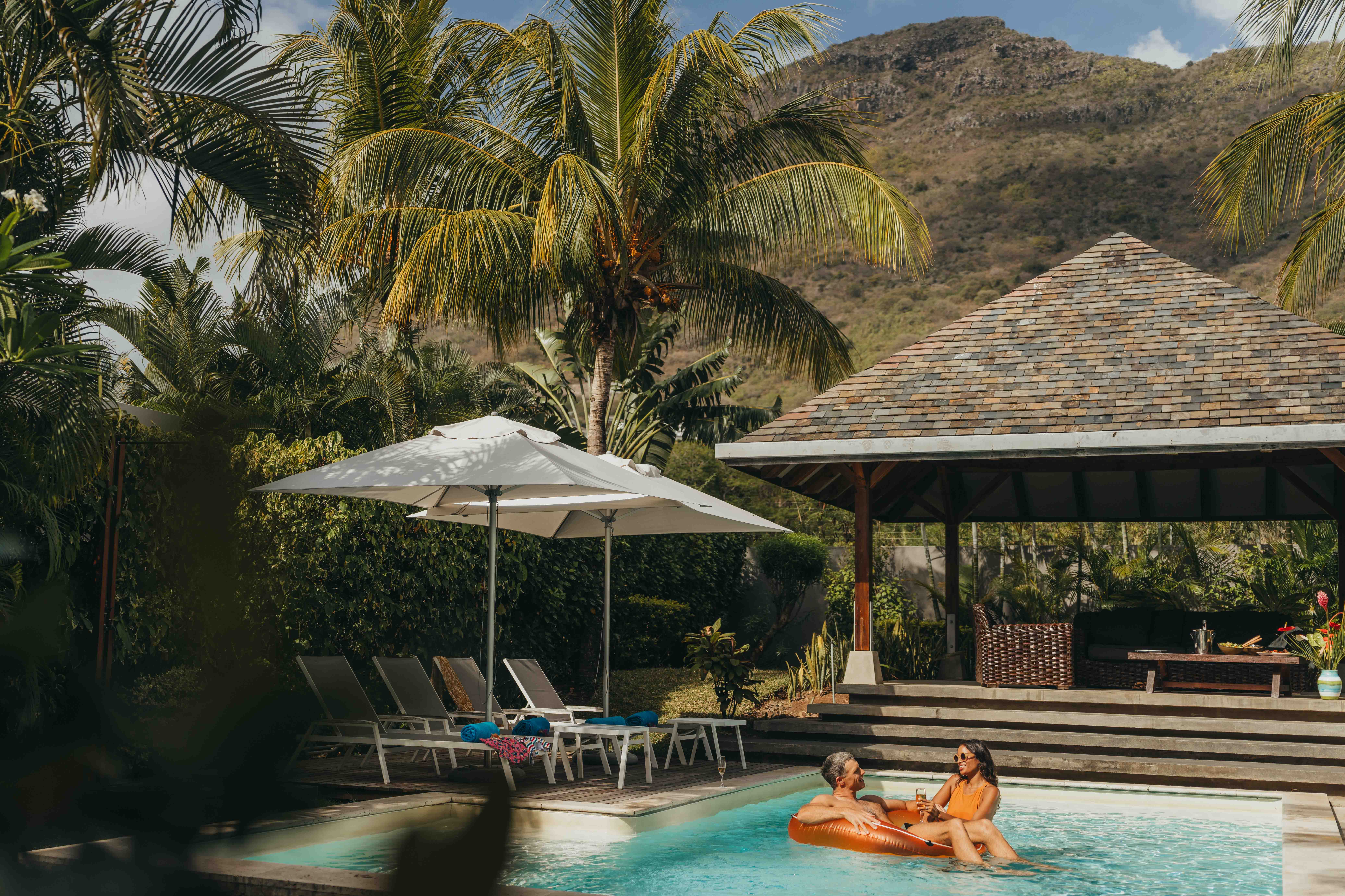 Turquoise pool and sun loungers at the Prestige Pool Villa with MJ Holidays in Mauritius.