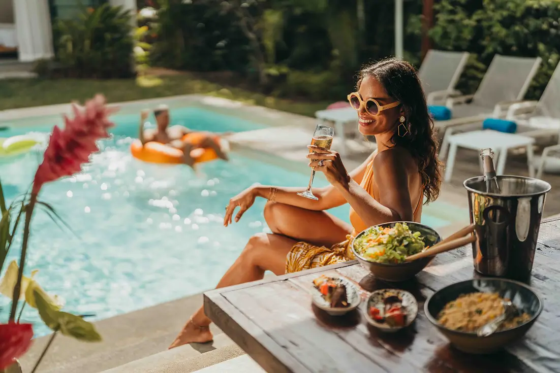 Woman relaxing by the pool at Marguery Villas with MJ Holidays in Mauritius.
