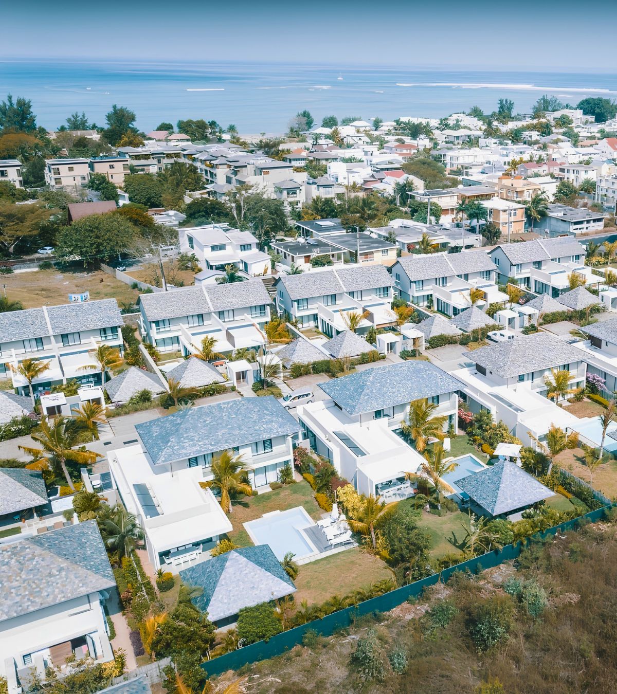 Black River coastal houses surrounded by tropical vegetation with MJ Holidays in Mauritius.