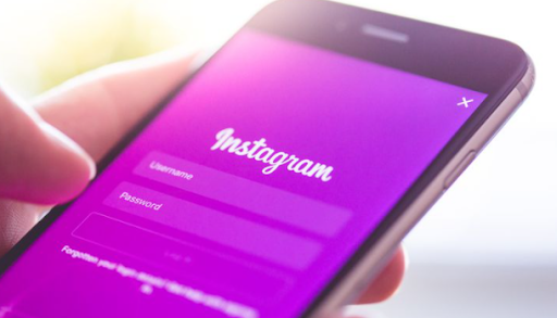 A photo of a person logging into Instagram from their phones
