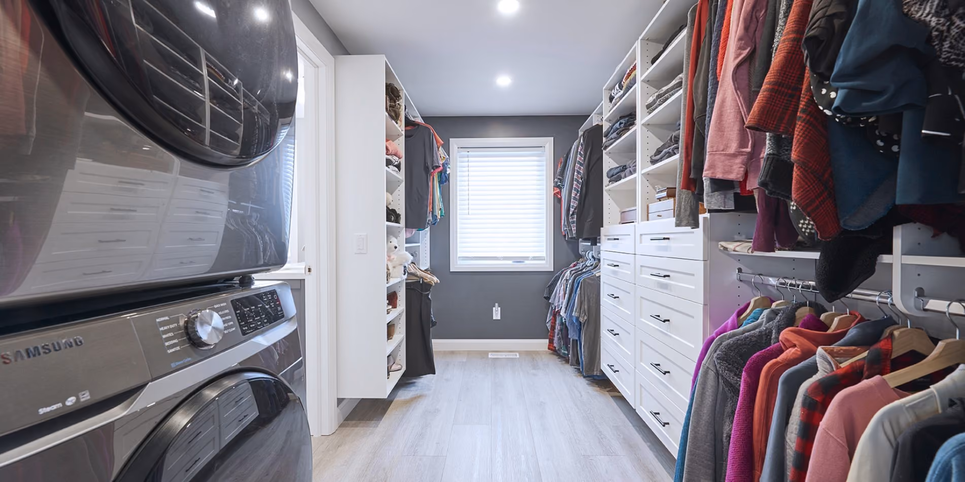 Walk-in closet with custom storage from a Pioneer Craftsmen home addition.