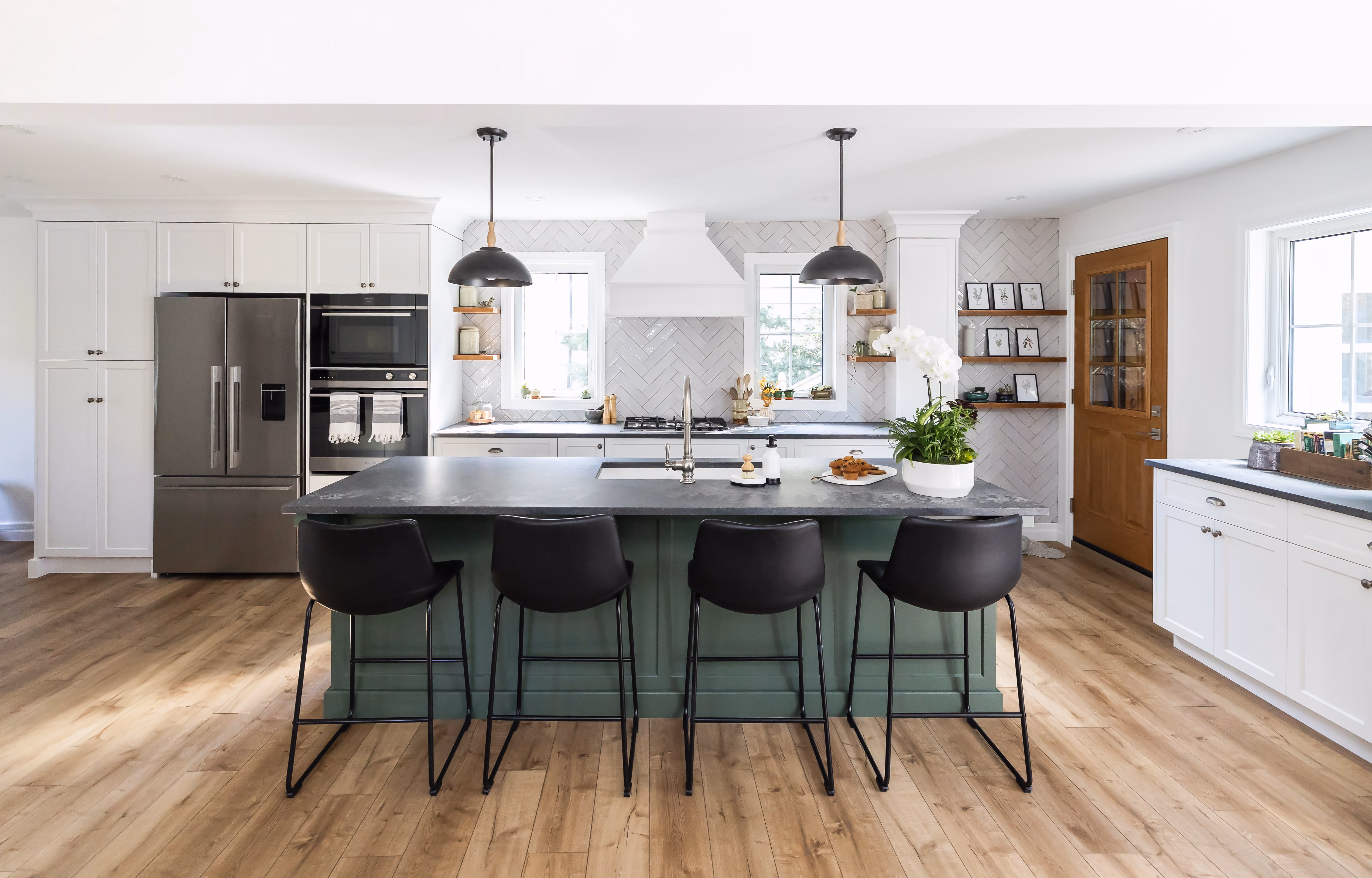 Blair Road kitchen renovation with white cabinetry, island seating, and custom millwork by Pioneer Craftsmen.