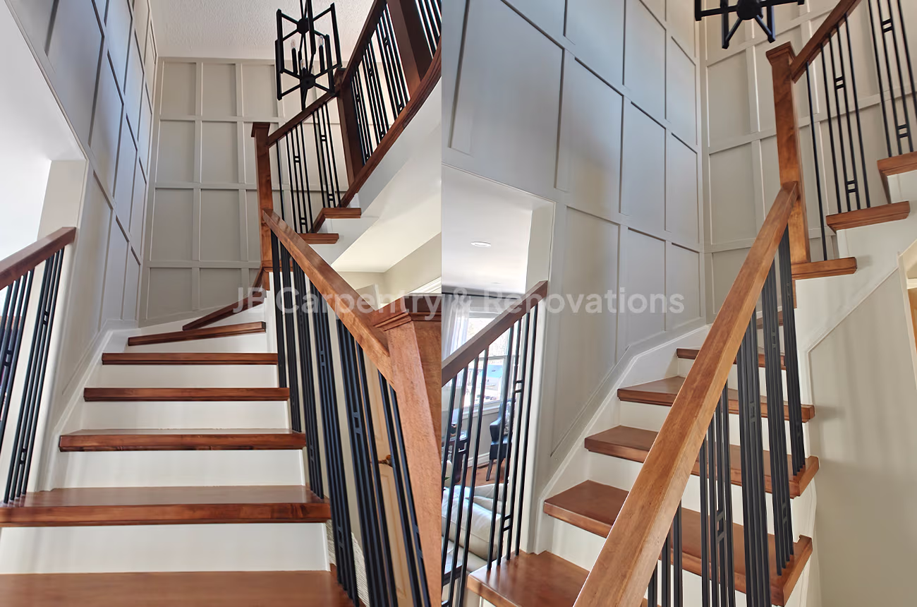 Modern wood staircase with black railings – Contemporary staircase featuring solid wood treads, black metal balusters, and painted wall paneling.