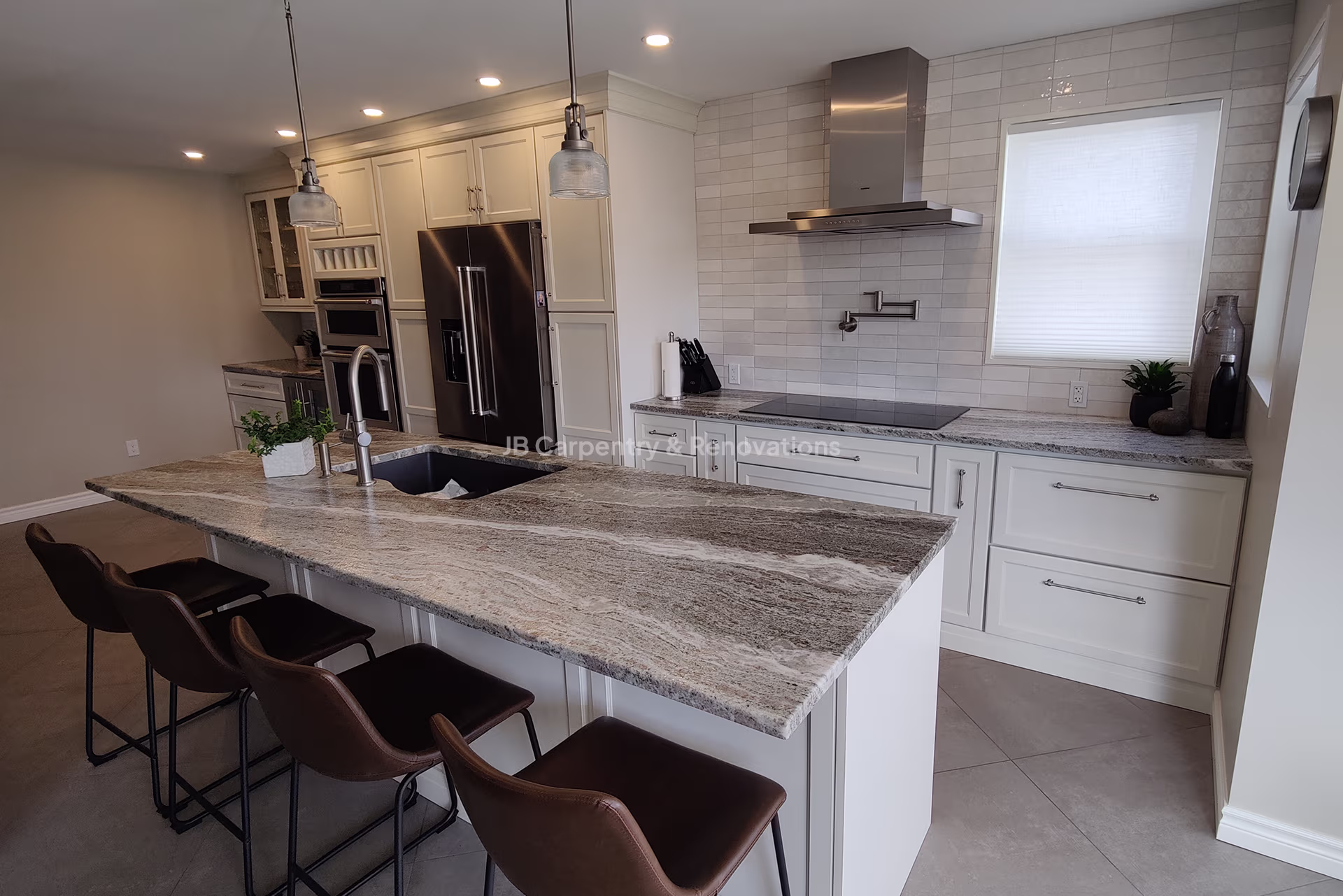 Custom kitchen with granite counters and pot filler faucet – Functional and stylish kitchen renovation featuring built-in appliances, tile backsplash, and a sleek island layout.