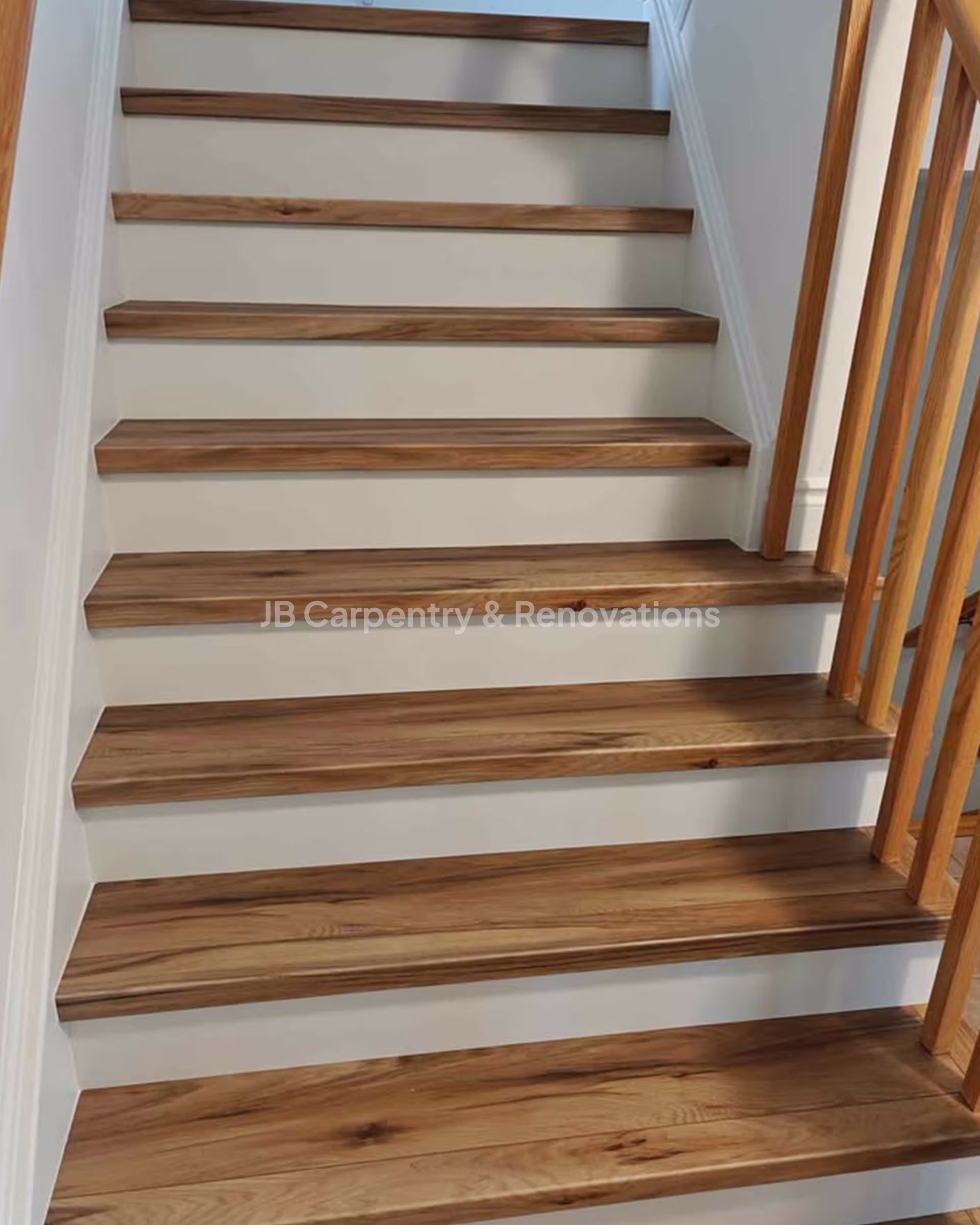 Solid wood staircase with custom nosings and handrail – Traditional oak staircase installation showcasing handcrafted nosings and matching wood railings.