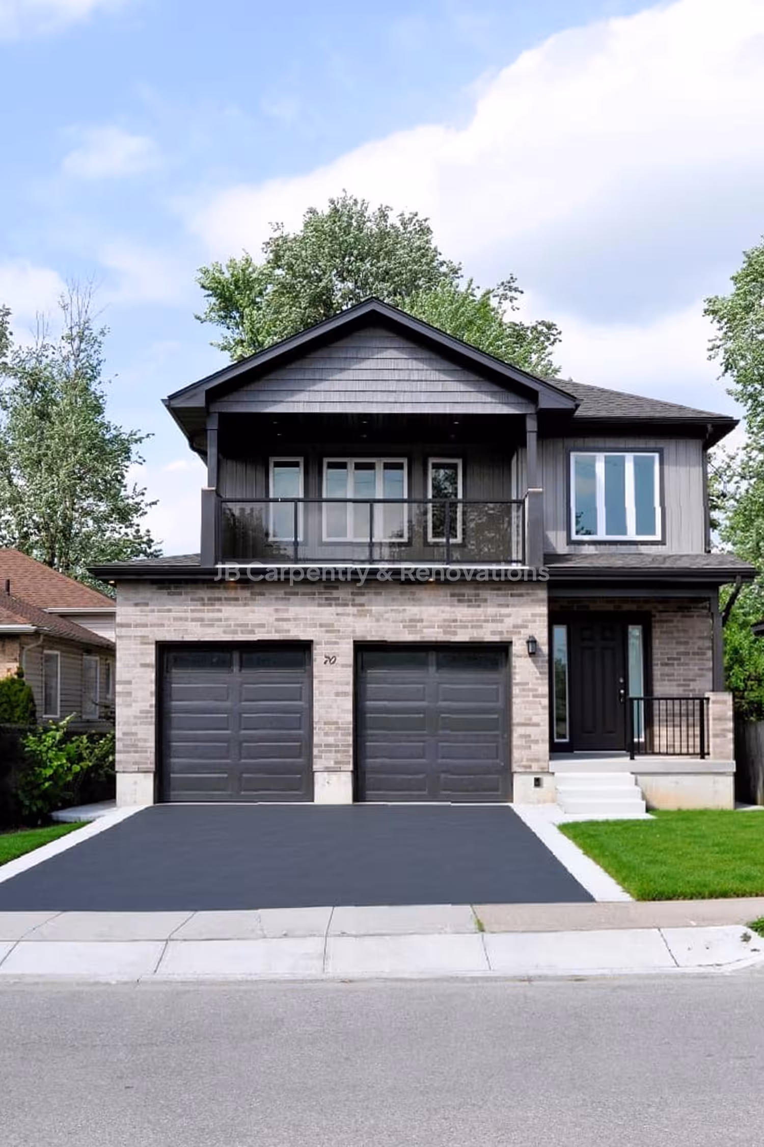 Modern two-story new build with double garage and balcony – Custom contemporary home featuring a brick and dark siding exterior, dual garage doors, and upper-level glass balcony.