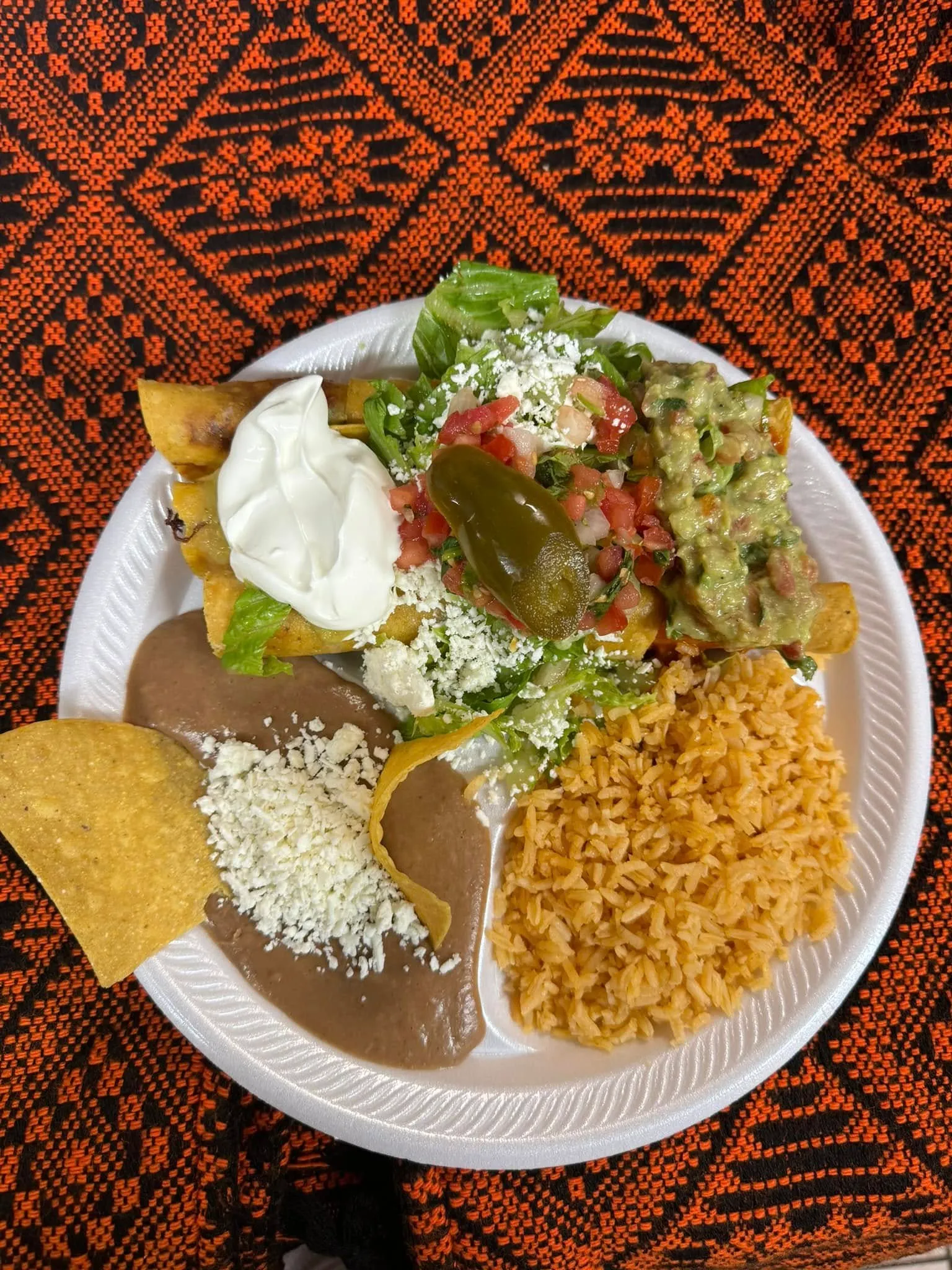 A delicious meal is served on a plate, placed on a rustic table.
