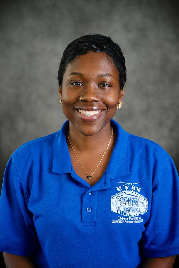 Staff member Tameka Francis in blue school polo